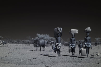 Macubal children fetching water in Angola on a photo tour