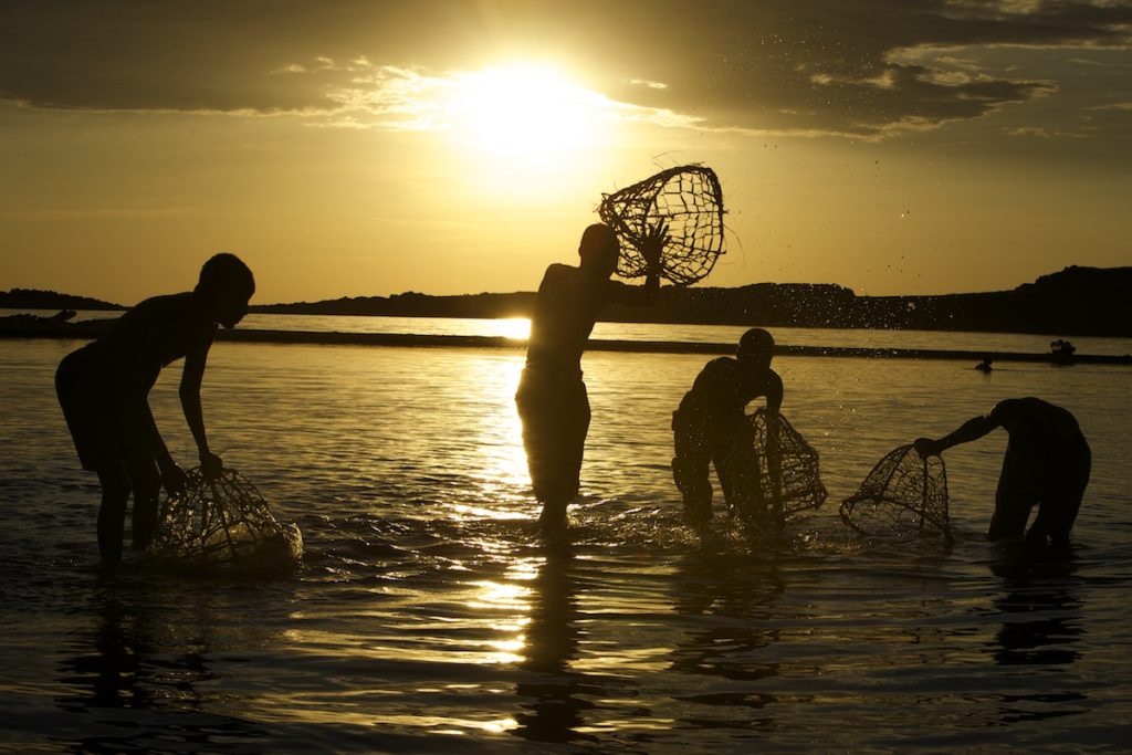 El molo tribe fishing along the shore of Lake Turkana during a photo tour