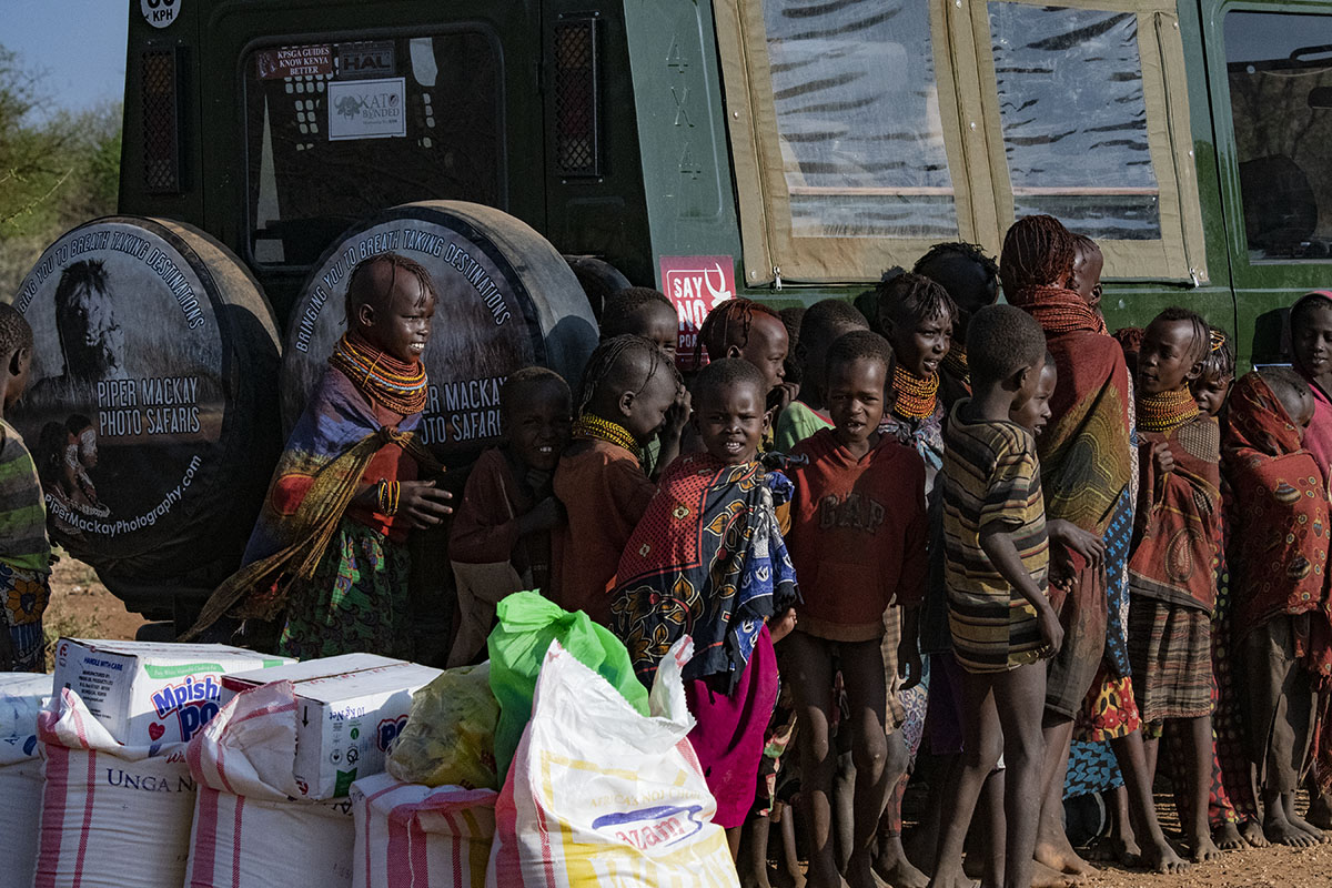 Donating food during the Authentic Tribal Expedition Northern Kenya