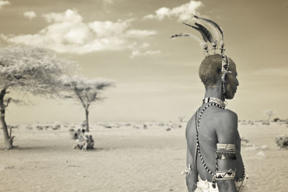 Rendile warrior in the stark African landscape captured during our tribal expedition