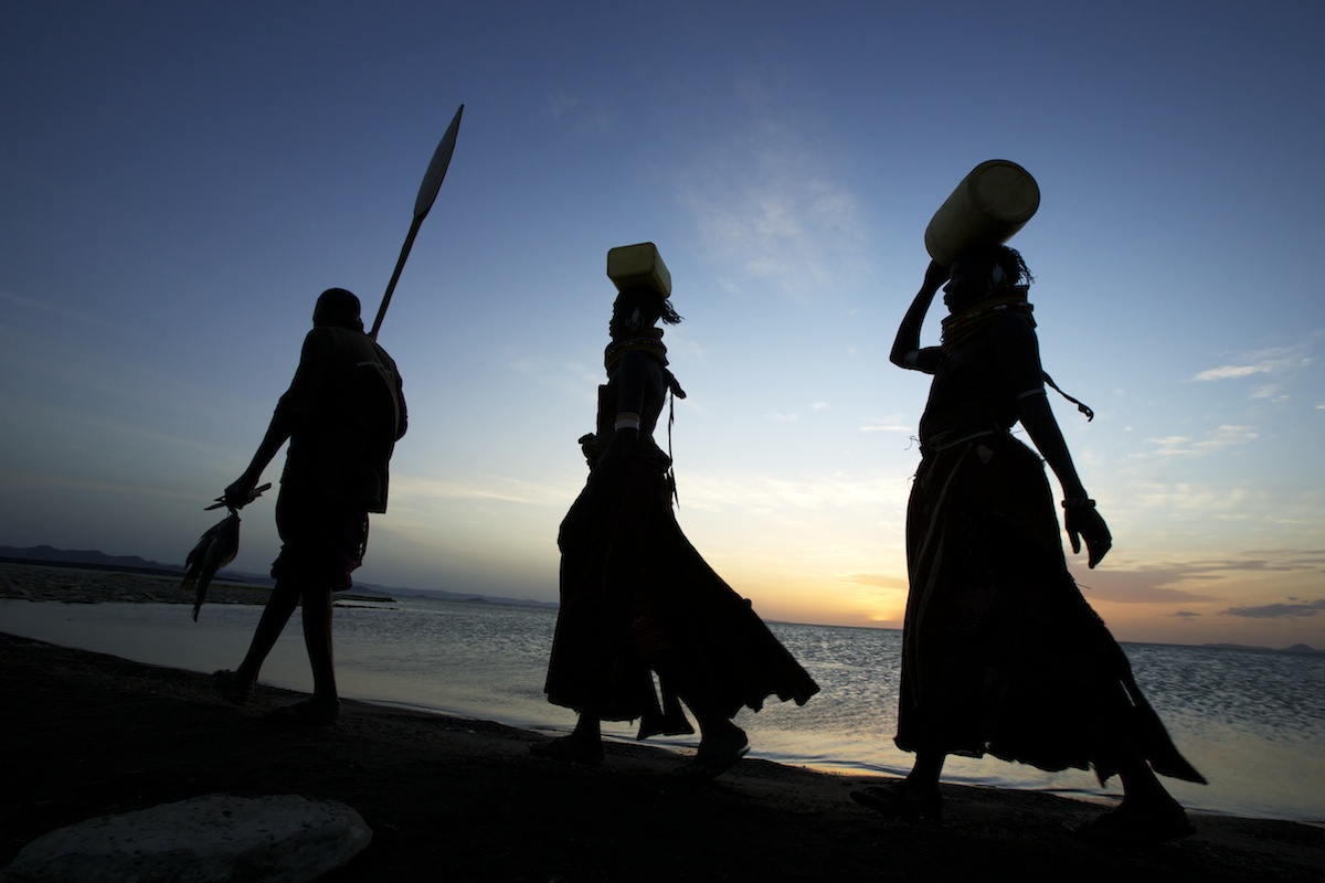Turkana tribe walking along the shores of Lake Turkana