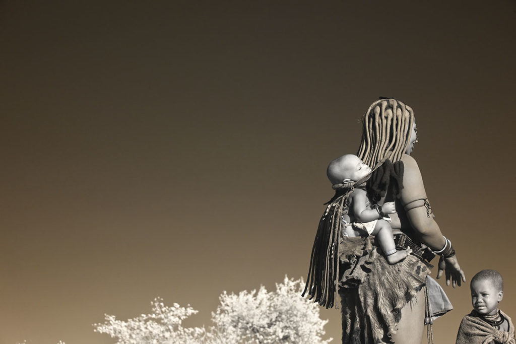 Himba women and child in Southern Angola