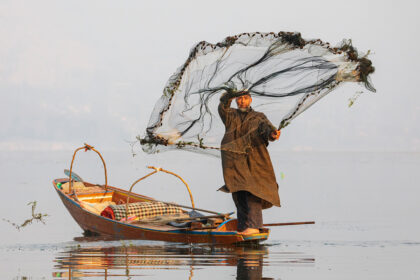 Portrait of a Fisherman Casting a Net
